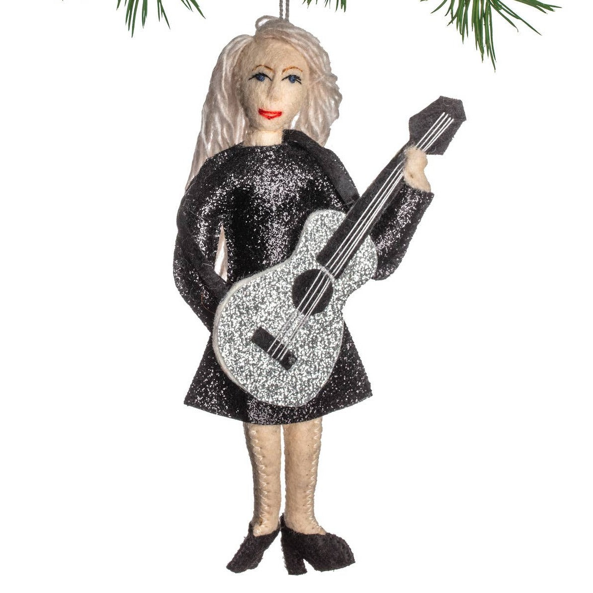 A felt ornament depicting a stylized version of Taylor Swift wearing a black shimmering dress and holding a silver glitter guitar.