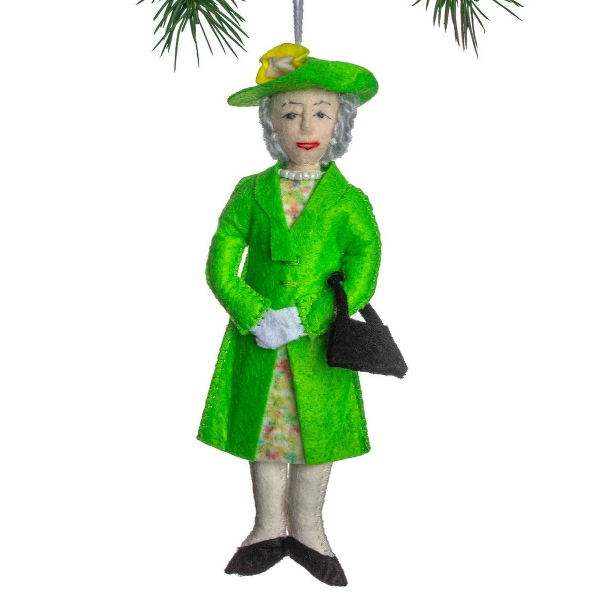 Decorative ornament of queen elizabeth in a green coat and hat on a white background